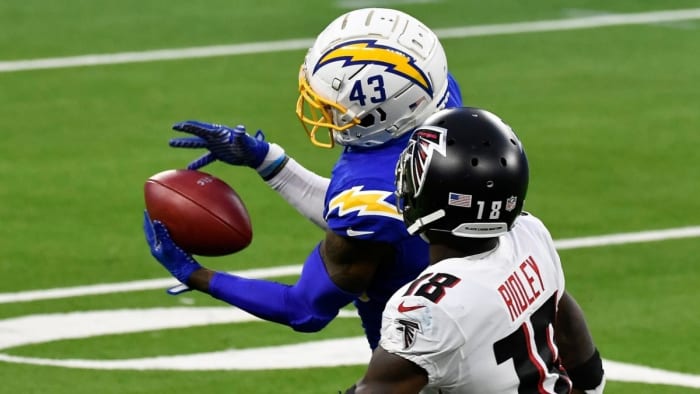 Davis intercepts a pass in front of Atlanta Falcons wide receiver Calvin Ridley.